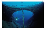 Scuba diver exploring a shipwreck, Papua New Guinea, Coral Sea. by Anonymous