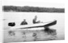 Two brothers speed by in a motor boat on a Wisconsin lake, ca. 1956 by Anonymous