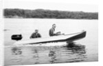 Two brothers speed by in a motor boat on a Wisconsin lake, ca. 1956 by Anonymous
