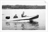 Two brothers speed by in a motor boat on a Wisconsin lake, ca. 1956 by Anonymous