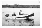 Two brothers speed by in a motor boat on a Wisconsin lake, ca. 1956 by Anonymous