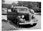 Eighteen year old boy with his first car, ca. 1944 by Anonymous