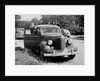 Eighteen year old boy with his first car, ca. 1944 by Anonymous