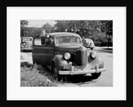 Eighteen year old boy with his first car, ca. 1944 by Anonymous