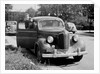 Eighteen year old boy with his first car, ca. 1944 by Anonymous