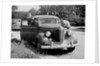 Eighteen year old boy with his first car, ca. 1944 by Anonymous
