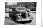 Eighteen year old boy with his first car, ca. 1944 by Anonymous