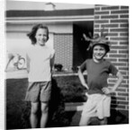 Brother and sister playing in front of their house, ca. 1965 by Anonymous