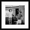 Brother and sister playing in front of their house, ca. 1965 by Anonymous