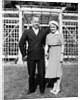 Middle aged couple pose on the lawn, ca. 1939 by Anonymous
