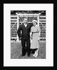 Middle aged couple pose on the lawn, ca. 1939 by Anonymous