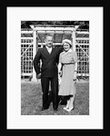 Middle aged couple pose on the lawn, ca. 1939 by Anonymous