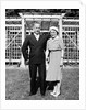 Middle aged couple pose on the lawn, ca. 1939 by Anonymous