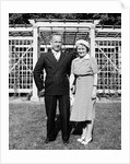 Middle aged couple pose on the lawn, ca. 1939 by Anonymous