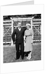 Middle aged couple pose on the lawn, ca. 1939 by Anonymous