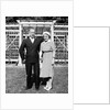 Middle aged couple pose on the lawn, ca. 1939 by Anonymous