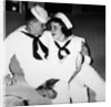 A sailor poses with his"sailor" girlfriend at a party, ca. 1955 by Anonymous