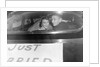 A couple peers out of the back window on their wedding day, ca. 1953 by Anonymous