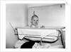 One year old baby girl enjoys her bath, ca. 1953 by Anonymous