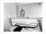 One year old baby girl enjoys her bath, ca. 1953 by Anonymous