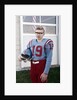 Fifteen year old high school football player portrait outside the school, ca. 1961 by Anonymous