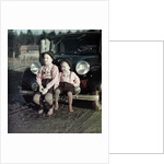 Two brothers sit on the bumper of the family Mercedes Benz in Germany, ca. 1949 by Anonymous