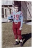 Fifteen year old high school football player portrait outside the school, ca. 1961 by Anonymous