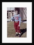 Fifteen year old high school football player portrait outside the school, ca. 1961 by Anonymous