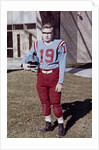 Fifteen year old high school football player portrait outside the school, ca. 1961 by Anonymous