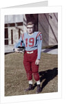 Fifteen year old high school football player portrait outside the school, ca. 1961 by Anonymous