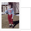 Fifteen year old high school football player portrait outside the school, ca. 1961 by Anonymous