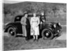 Father and mother stand with their son sitting on the hood of their Mercedes automobile, ca. 1950 by Anonymous