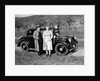 Father and mother stand with their son sitting on the hood of their Mercedes automobile, ca. 1950 by Anonymous