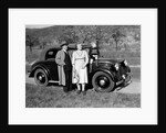 Father and mother stand with their son sitting on the hood of their Mercedes automobile, ca. 1950 by Anonymous
