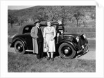 Father and mother stand with their son sitting on the hood of their Mercedes automobile, ca. 1950 by Anonymous