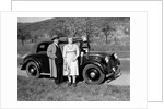 Father and mother stand with their son sitting on the hood of their Mercedes automobile, ca. 1950 by Anonymous