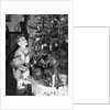 Two brothers look at a Christmas tree in their living room in Germany, ca. 1949 by Anonymous