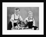 Two brothers sit with Easter decorations, ca. 1948 by Anonymous