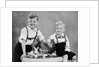 Two brothers sit with Easter decorations, ca. 1948 by Anonymous