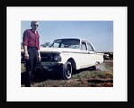 Sixteen year old boy stands with his 1960 Mercury Comet automobile, ca. 1962 by Anonymous