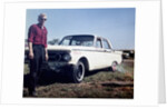 Sixteen year old boy stands with his 1960 Mercury Comet automobile, ca. 1962 by Anonymous