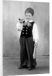 Six year old boy in Bavarian costume holds a pipe, ca. 1947 by Anonymous