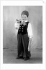 Six year old boy in Bavarian costume holds a pipe, ca. 1947 by Anonymous