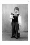 Six year old boy in Bavarian costume holds a pipe, ca. 1947 by Anonymous