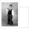 Six year old boy in Bavarian costume holds a pipe, ca. 1947 by Anonymous