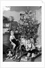 Two brothers are shown with their toys under the Christmas tree in Germany, ca. 1949 by Anonymous