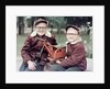 Two brothers play with a Buddy L steam shovel toy in Wisconsin, ca. 1953 by Anonymous