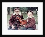 Two brothers play with a Buddy L steam shovel toy in Wisconsin, ca. 1953 by Anonymous