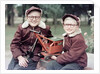 Two brothers play with a Buddy L steam shovel toy in Wisconsin, ca. 1953 by Anonymous