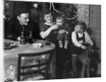 One year old baby boy gets a drink of Coca Cola in front of the Christmas tree, ca. 1946 by Anonymous